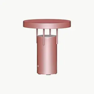 BringMe Portable Lamp Mini i Metallic Pink fra Hübsch, bærbar bordlampe i metall med kompakt form og rund lampeskjerm.